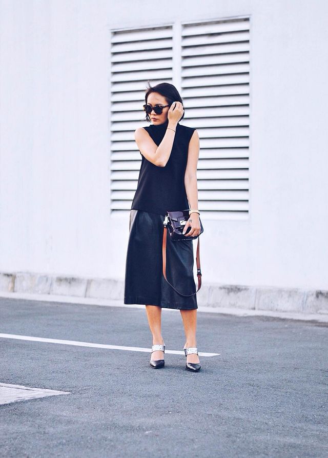 Black t-shirt sleeve less top and black leather culottes pants