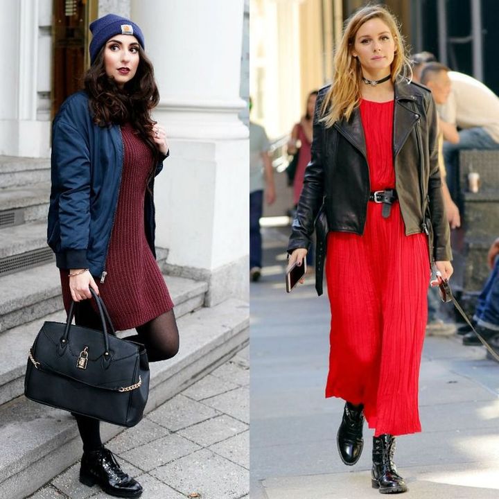 Woman wearing a navy bomber jacket, burgundy sweater dress, black tights, and black ankle boots with a black handbag; woman in a red pleated dress, black leather jacket, and black combat boots holding a phone