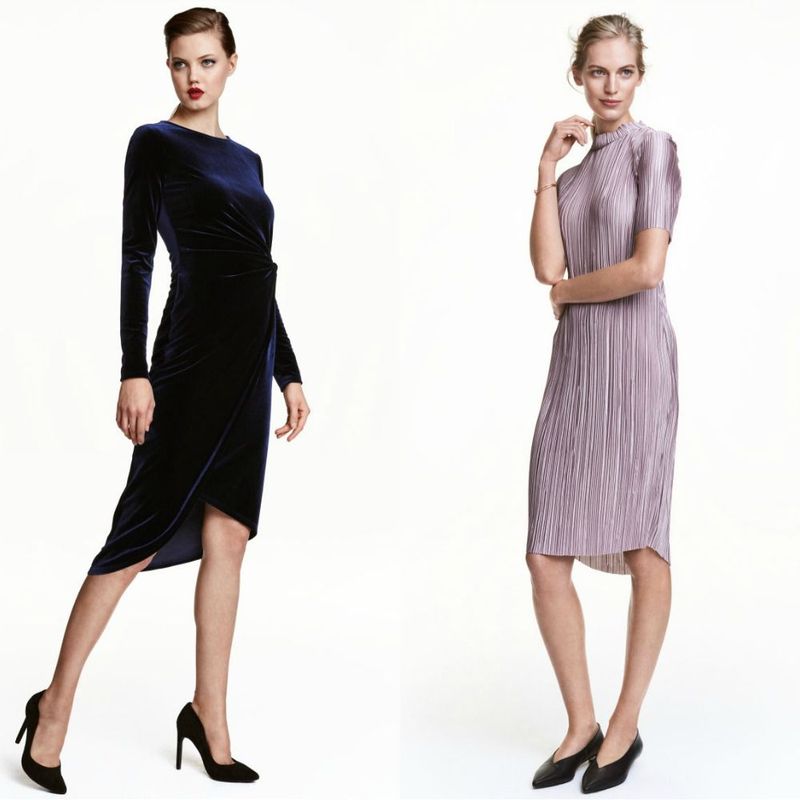 Woman wearing a navy velvet wrap dress with long sleeves and black stiletto heels, alongside a woman in a light purple pleated midi dress and black pointed-toe flats