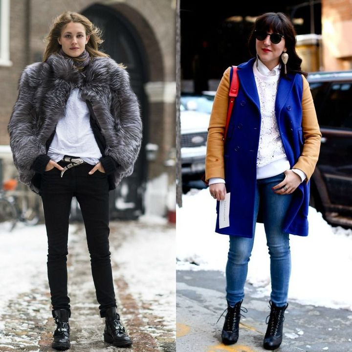 Woman wearing a grey faux fur coat, white shirt, black skinny jeans, and black lace-up boots; woman in a blue and tan color-block coat, white top, and blue skinny jeans with black ankle boots