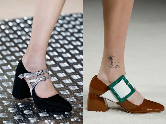 Close-up of two pairs of heels: one black suede with silver straps, the other brown leather with a green and white buckle