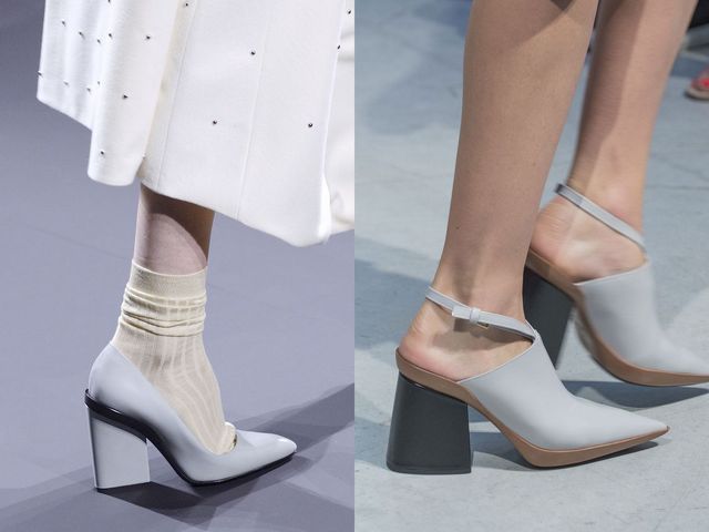 Close-up of a woman wearing gray pointed-toe heels with a block heel and beige ankle socks