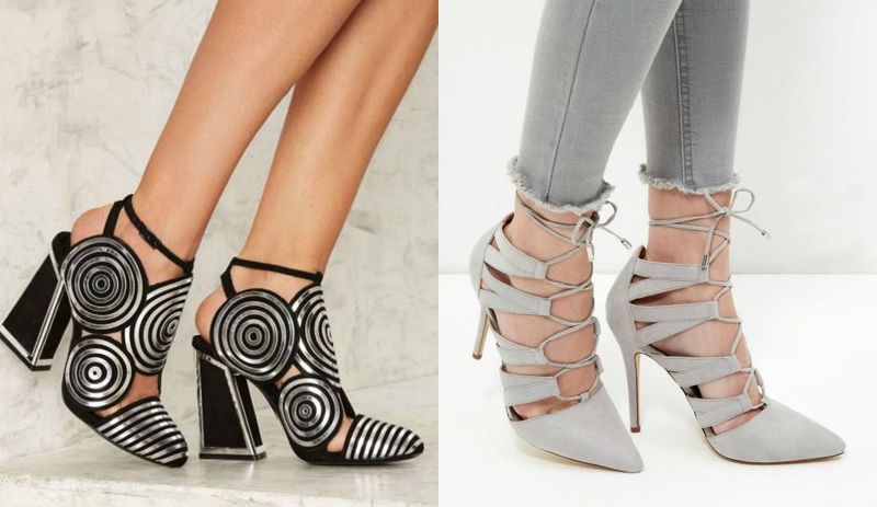 Close-up of black and white striped high heel sandals with circular designs and grey lace-up stiletto heels