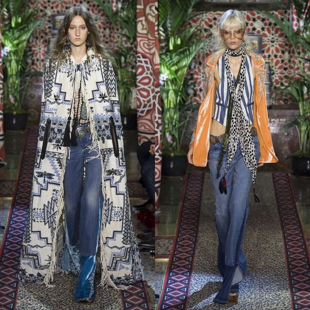 Two women wearing a patterned long cardigan, striped crop top, and high-waisted denim jeans with blue ankle boots and sunglasses