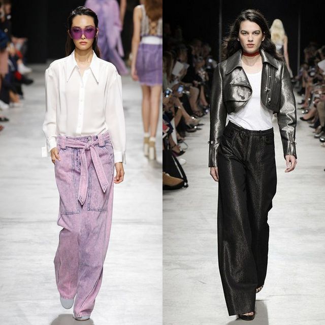 Woman wearing a white button-up shirt, pink wide-leg jeans and purple sunglasses, alongside another woman in a silver cropped jacket and black wide-leg trousers
