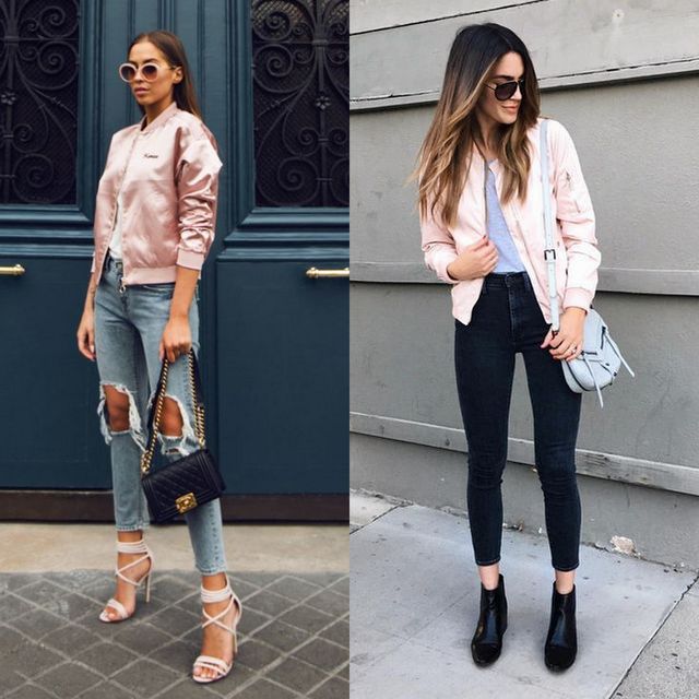 Woman wearing a light pink bomber jacket, grey t-shirt, distressed blue skinny jeans, and clear strap heels