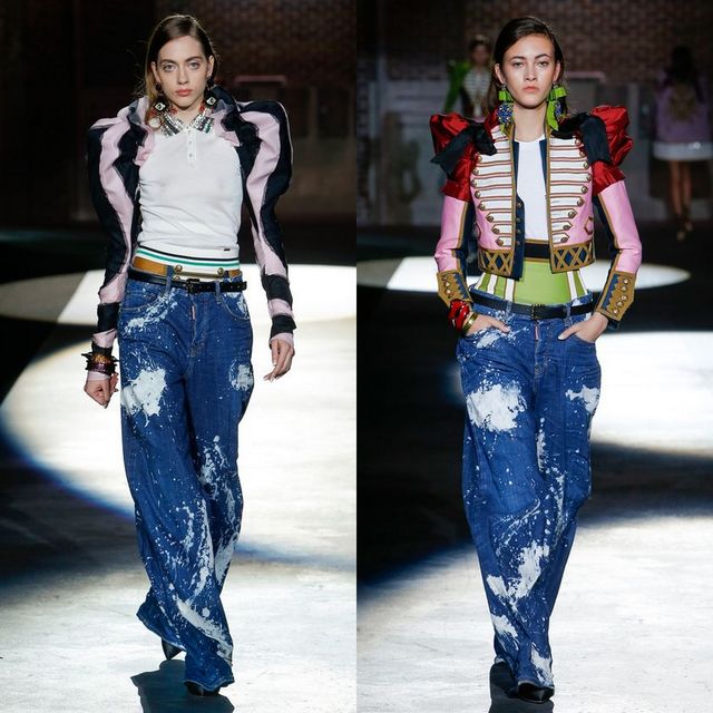 Woman wearing a white fitted top, colorful cropped jacket, and oversized distressed denim jeans with black heels