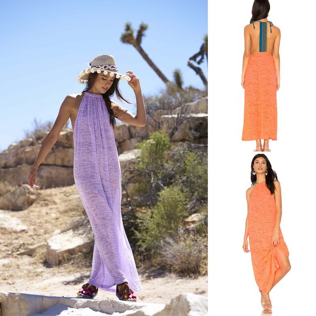 Woman wearing a purple halter maxi dress with a gathered neckline and a straw sun hat in a desert setting