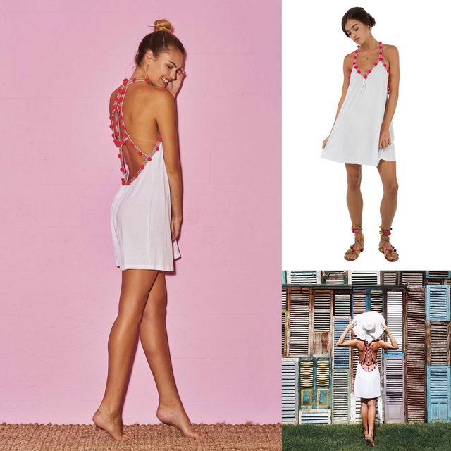 Woman wearing a white halter dress with colorful pom-pom details and brown strappy sandals