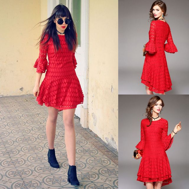 Woman wearing a red textured dress with flared sleeves and black ankle boots, accessorized with round sunglasses