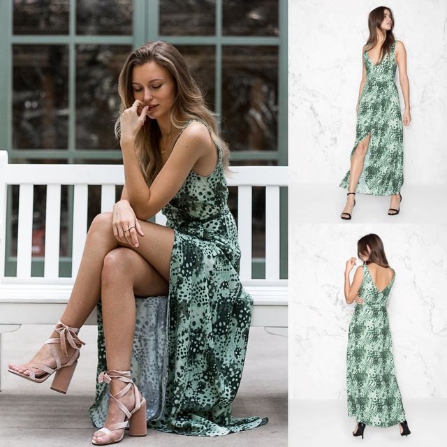 Woman wearing a green patterned maxi dress with a side slit and nude strappy heels