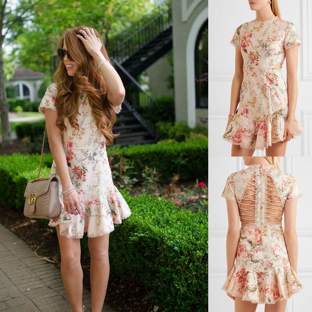 Woman wearing a cream floral mini dress with short sleeves and a ruffled hem, paired with sunglasses and a beige handbag
