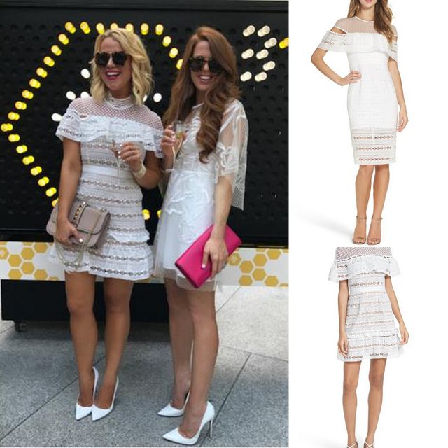 Two women wearing white lace off-the-shoulder dresses, one with a pink clutch and the other with a silver bracelet, paired with white high heels