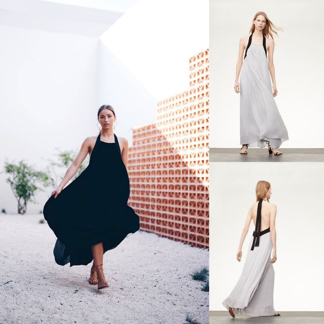 Woman wearing a black halter maxi dress with a flowing skirt and brown strappy sandals