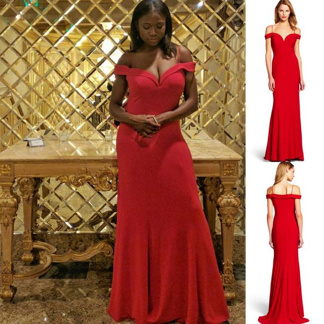 Woman in a red off-the-shoulder gown with a fitted bodice and flared skirt