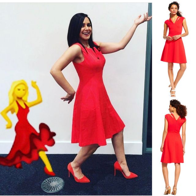 Woman wearing a red fit-and-flare dress and red high heels, posing with one hand raised
