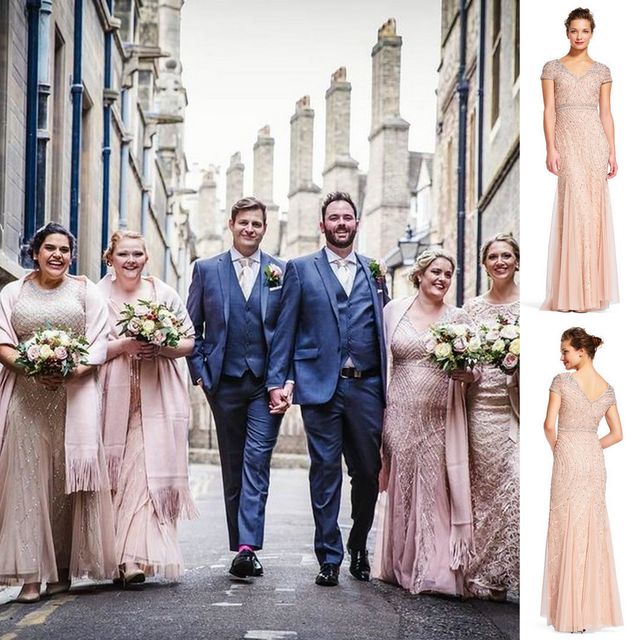 Group of women in blush pink sequin gowns with short sleeves, holding bouquets, alongside a man in a grey suit and tie