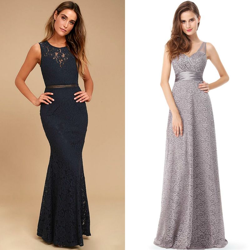 Woman in a navy lace mermaid gown with a fitted bodice and a silver embellished waistband, alongside a woman in a silver lace evening gown with a fitted waist and flowing skirt