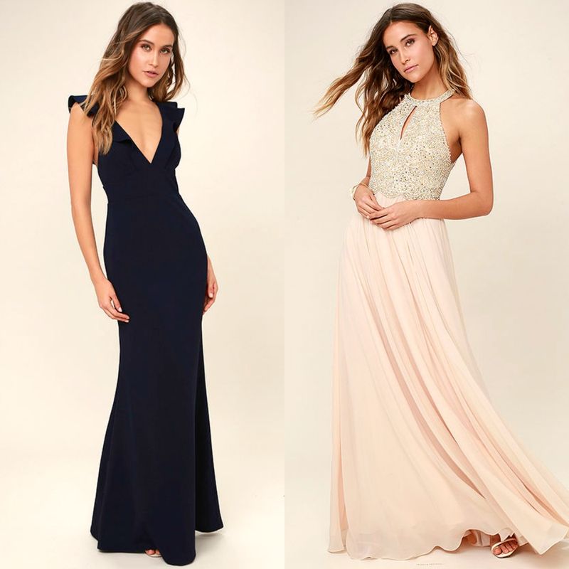 Woman wearing a navy blue mermaid gown with ruffle straps and another woman in a blush pink gown with a beaded bodice and flowing skirt
